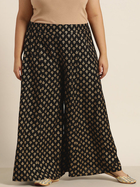 

Juniper Plus Women Black & Gold-Toned Ethnic Motifs Printed Flared Liva Ethnic Palazzos