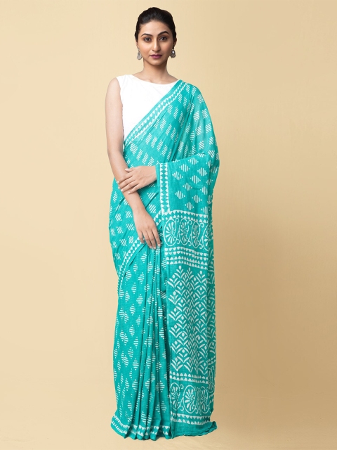 

Unnati Silks Turquoise Blue & White Dabu Pure Cotton Dabu Saree