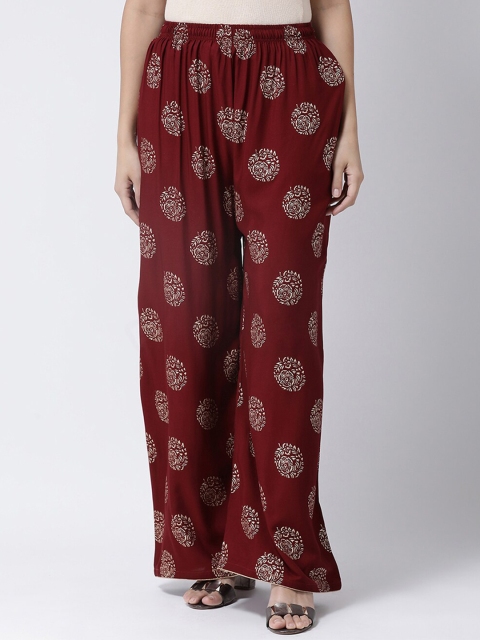 

Charitra Women Maroon Ethnic Motifs Printed Flared Ethnic Palazzos