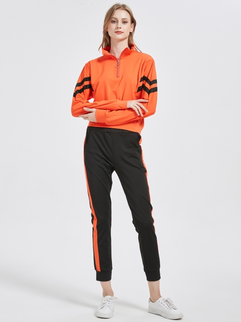 

URBANIC Women Orange & Black Solid Tracksuit