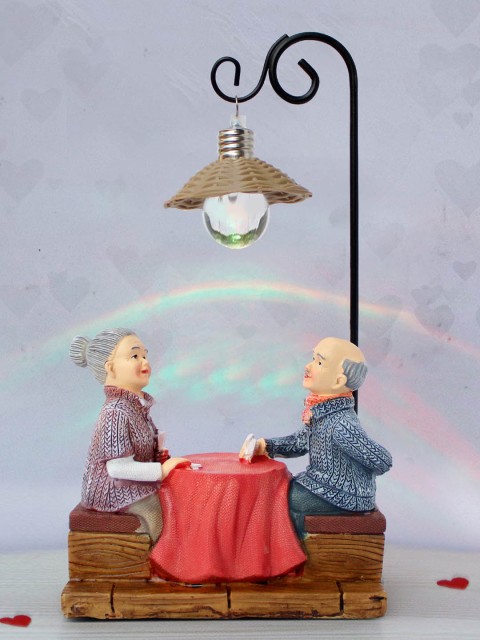 

TIED RIBBONS Brown & Red Polyresin Handcrafted Romantic Old Age Couple Showpiece