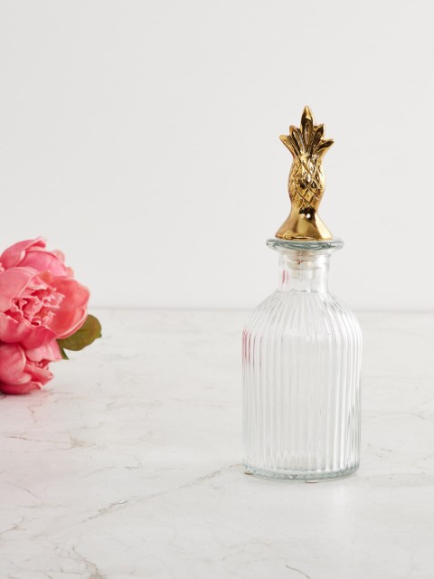 

Home Centre Transparent & Gold Toned Glass Decanter With Pineapple Metal Lid