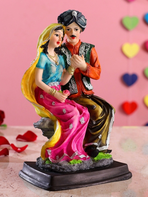 

Ferns N Petals Multicoloured Beautiful Sitting Rajasthani Couple Figurine, Multi