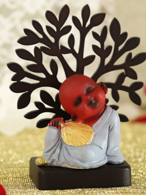 

Ferns N Petals Red & Grey Monk Idol Sitting Under A Tree Showpiece