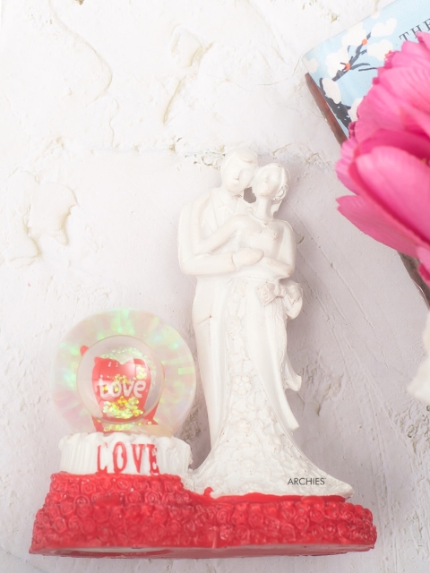 

Archies White & Red Couple Figurine Showpiece