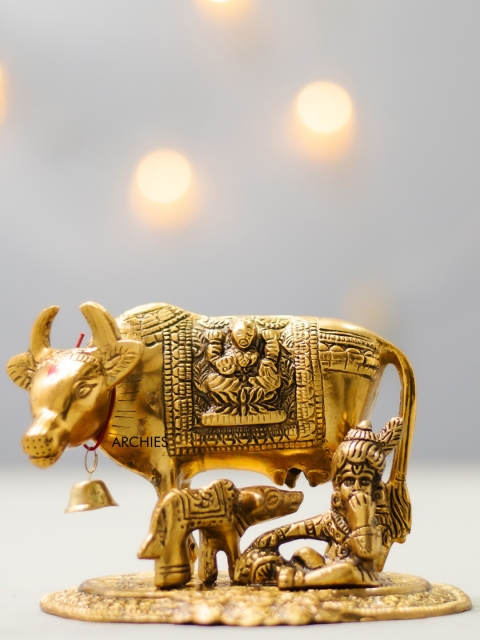 

Archies Gold-Toned & Brown Kamdhenu Cow With Laddu Gopal Showpiece Gift Set