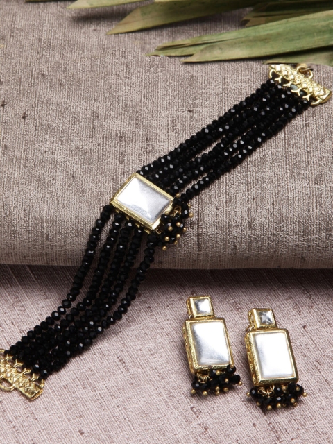

KARATCART Gold Plated White Kundan Studded Black Beaded Jewellery Set