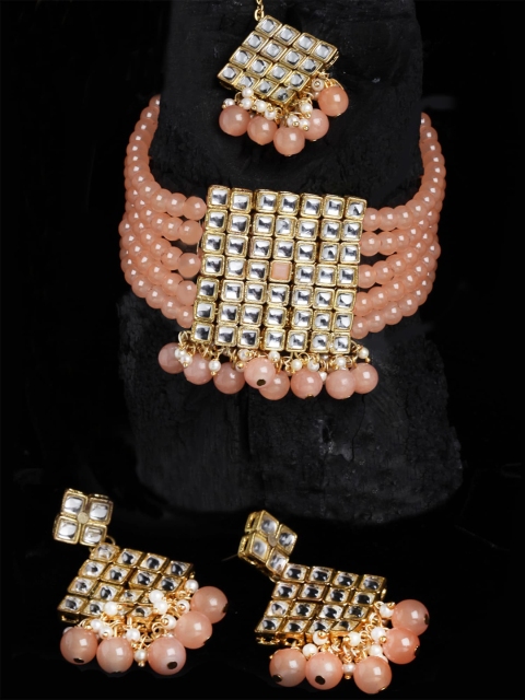 

KARATCART Gold Plated White Kundan Studded Peach Beaded Jewellery Set