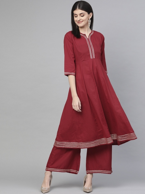 

Bhama Couture Women Red Panelled Kurta with Palazzos