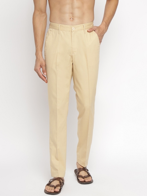 

Fabindia Men Beige Solid Trousers