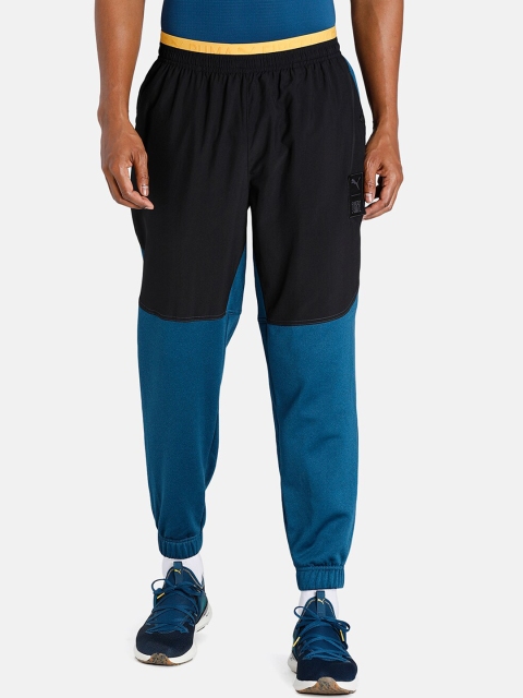 

Puma Men Black & Blue Colourblocked Track Pants