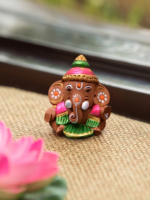 

ExclusiveLane Brown Hand-Painted Terracotta Ganesha Idol Showpiece