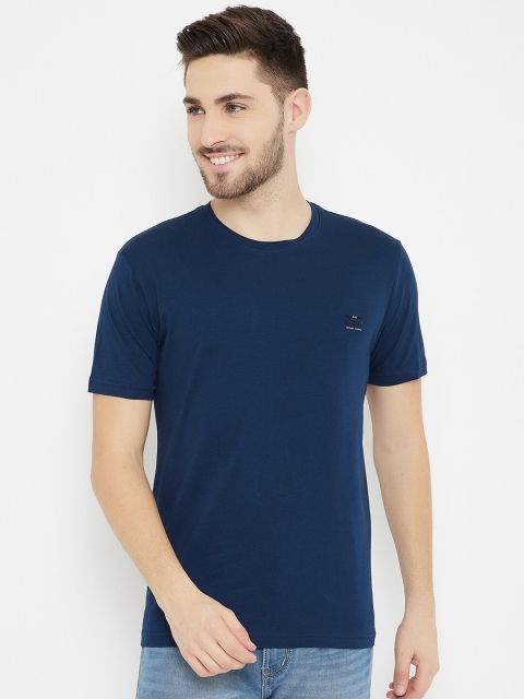 

Okane Men Navy Blue Solid T-shirt