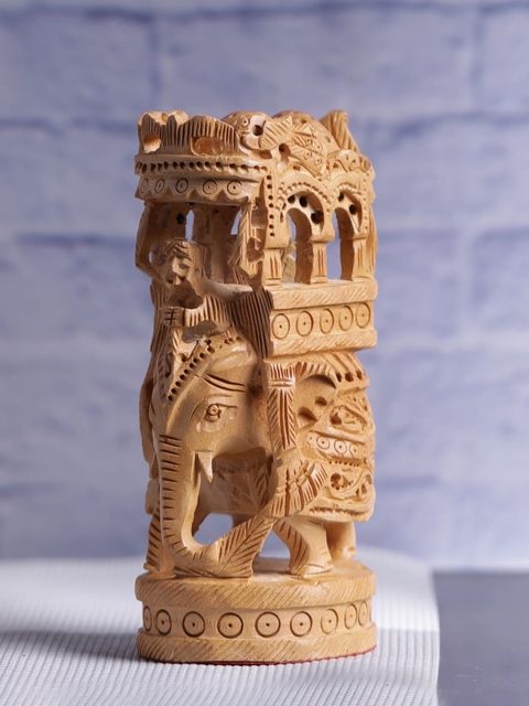 

Aapno Rajasthan Brown Hand Carved Wooden Ambabari Elephant Showpiece