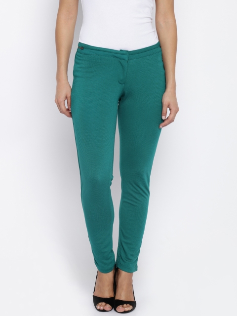 

Park Avenue Women Green Solid Trousers