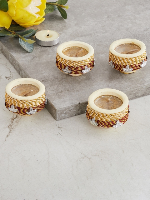 

Home Centre Set Of 4 Beige & Yellow Clay Embellished Candle Holder