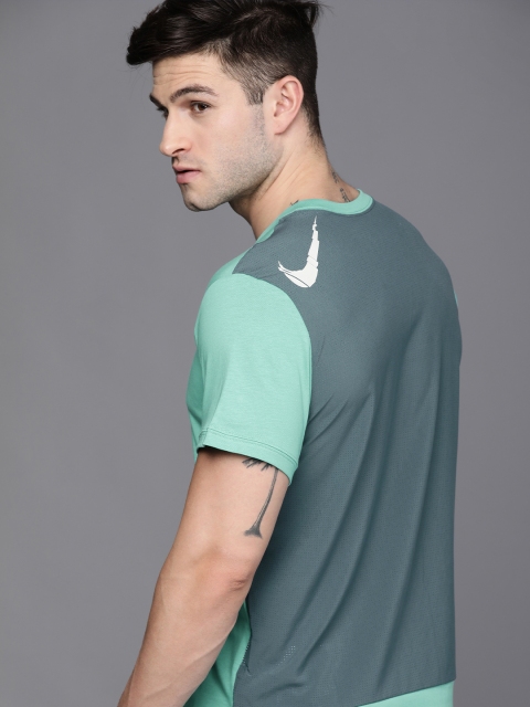 

Nike Men Sea Green Solid Q5 SS Round Neck Dri-FIT Training T-shirt