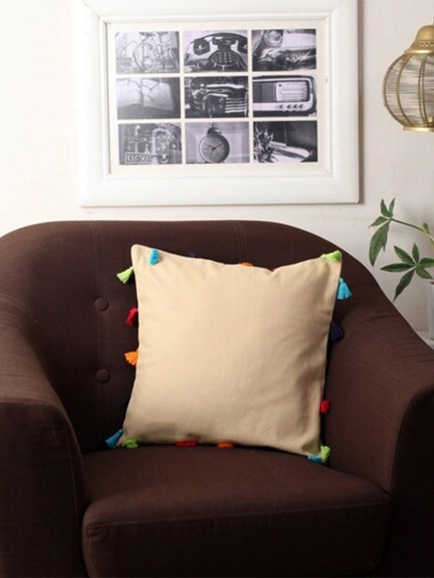 

Lushomes Beige Square Cushion Covers With Multi-Coloured Tassels