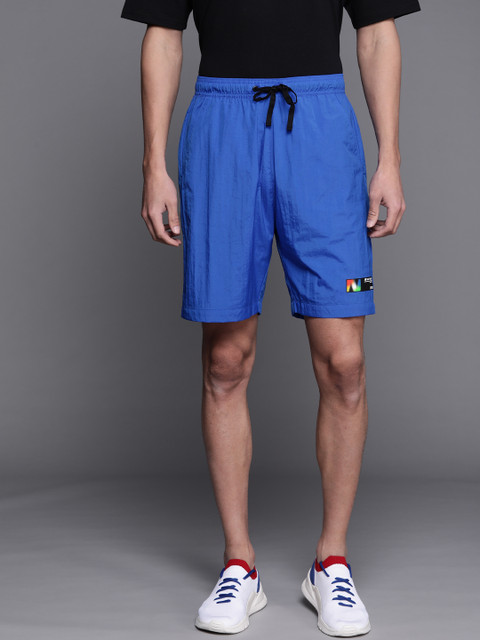 

New Balance Men Blue Solid Sports Shorts