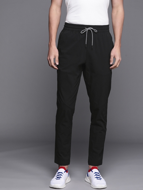 

New Balance Men Black Solid Track Pants