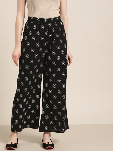 

Moda Rapido Women Black & White Pure Cotton Eye Printed Flared Palazzos