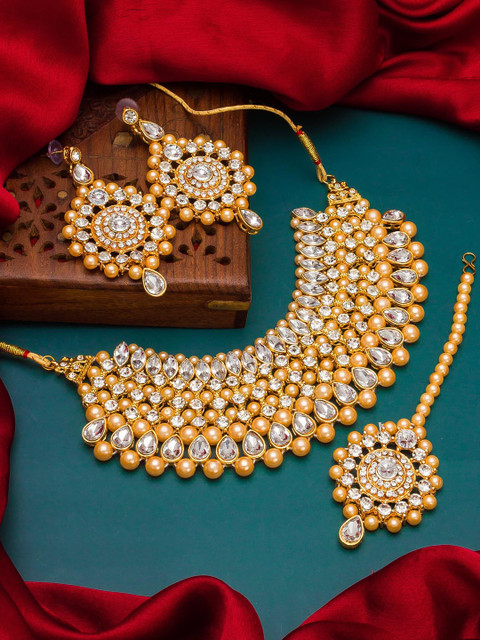 

aadita Gold-Plated & White Kundan-Studded & Pearls Beaded Handcrafted Matinee Temple Jewellery Set
