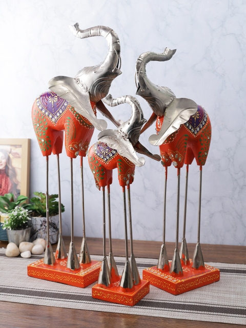

Aapno Rajasthan Set Of 3 Silver-Toned & Orange Elephant Figurine Showpiece Set