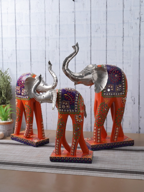 

Aapno Rajasthan Orange & Silver Coloured Set of 3 Metal Elephant Showpiece