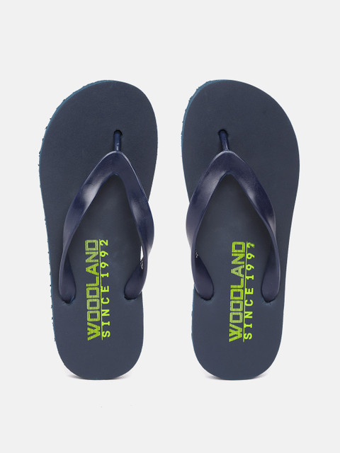 

Woodland Men Navy Blue & Fluorescent Green Brand Logo Print Thong Flip-Flops