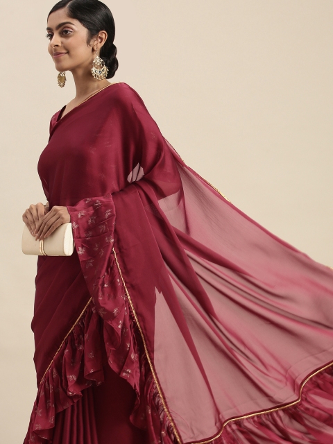 

Sangria Maroon Silk Blend Solid Saree with Foil Print Ruffled Border