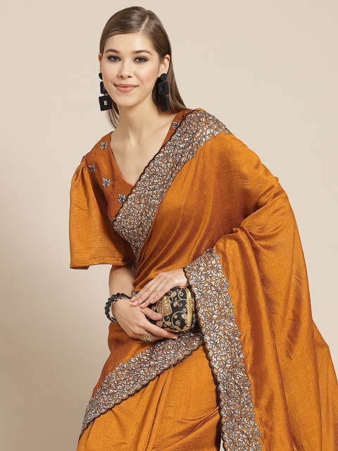 

Tikhi Imli Mustard Brown & White Embroidered Heavy Work Saree