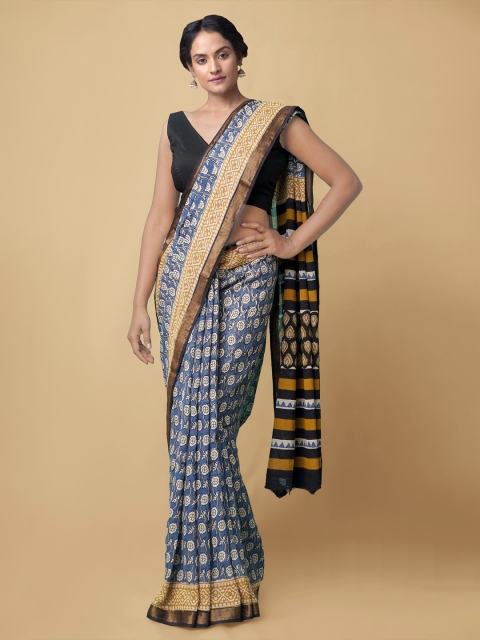 

Unnati Silks Blue & White Ethnic Motifs Zari Bagru Saree