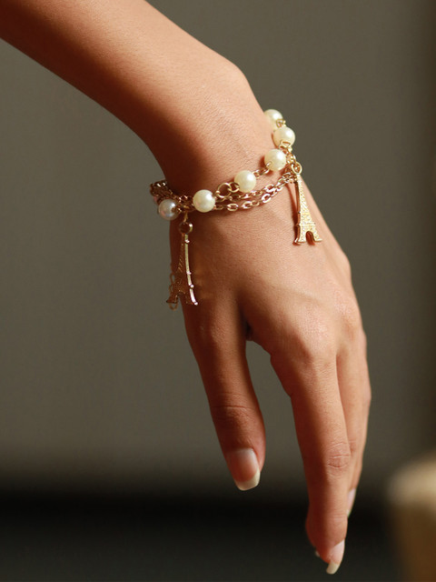 

Ayesha Women Gold-Plated & White Statement Eiffel Tower Pearls Charm Bracelet