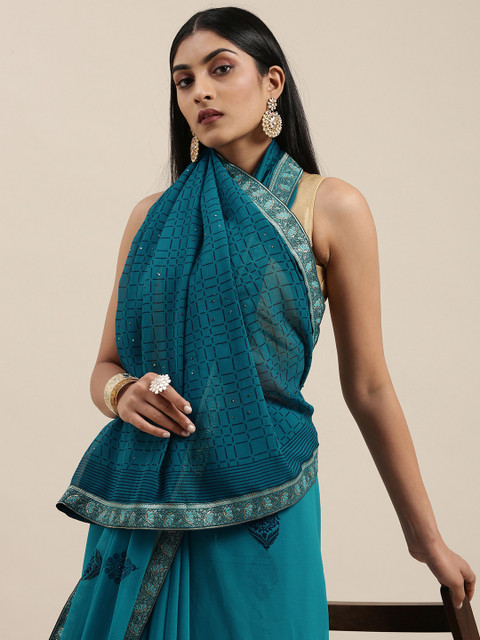

Triveni Blue Printed Pure Georgette Saree