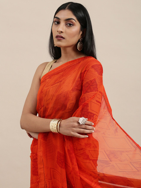 

Triveni Orange Printed Pure Georgette Saree