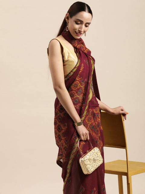 

Triveni Maroon Printed Poly Georgette Saree