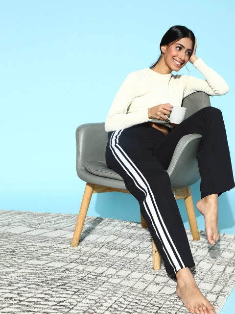 

ANWAIND Women Black Solid Kick Flare Lounge Pants