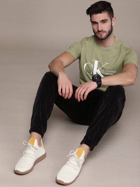 

Calvin Klein Jeans Men Olive Green Brand Logo Printed Pure Cotton T-shirt