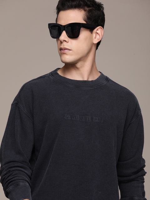 

Calvin Klein Jeans Men Black Self Designed Long Sleeves Pure Cotton Casual T-shirt