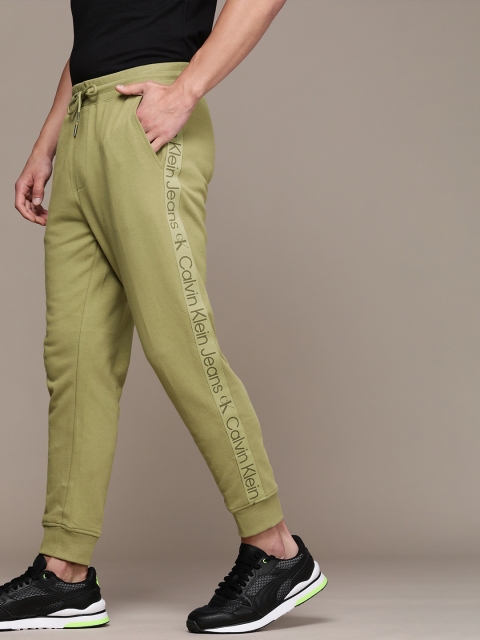 

Calvin Klein Jeans Men Faded Olive Green Solid Sweat Joggers with Brand Logo Side Taping