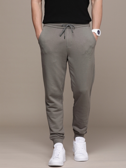 

Calvin Klein Jeans Men Grey Solid Mid Rise Pure Cotton Applique Regular Joggers