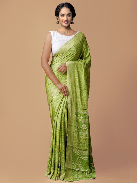 

Unnati Silks Green & White Ethnic Motifs Patola Saree