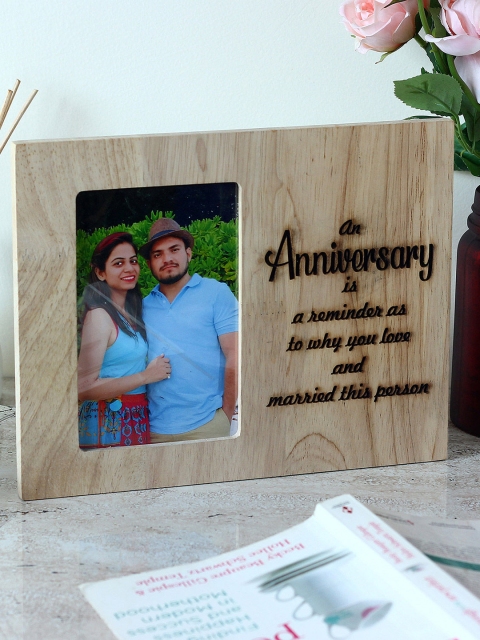 

Ferns N Petals Brown Anniversary Engraved Wooden Photo Frame
