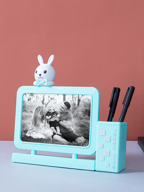 

Ferns N Petals Blue Bunny Photo Frame Cum Pen Holder