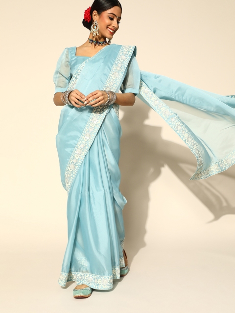 

Inddus Blue Organza Saree With Floral Embroidered Border