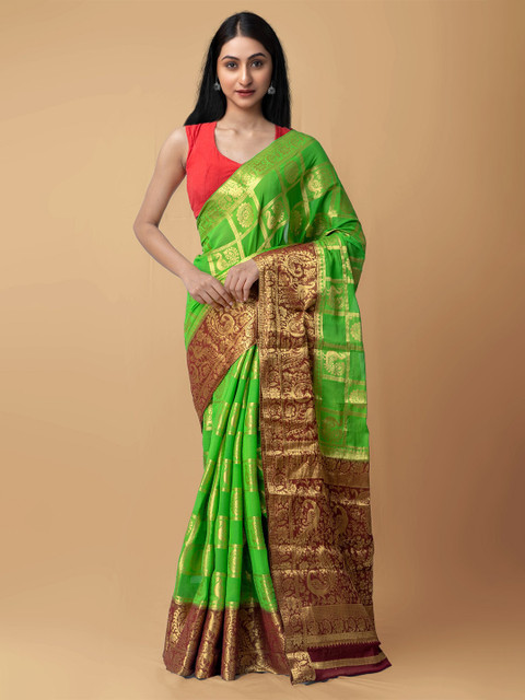 

Unnati Silks Green & Brown Ethnic Motifs Zari Banarasi Saree
