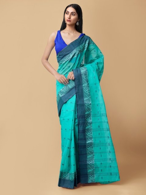 

Unnati Silks Turquoise Blue Ethnic Motifs Pure Cotton Taant Saree