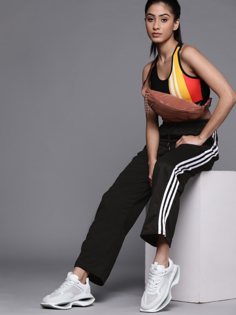 

JC Mode Women Black Solid Track Pants with Side Stripe Detail