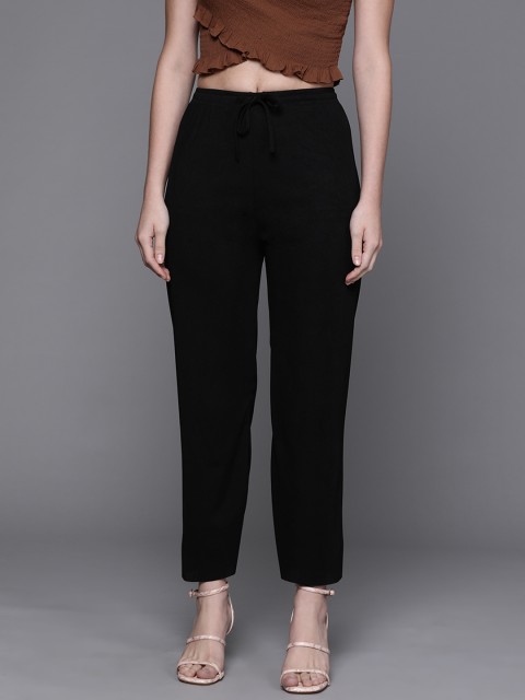 

JC Mode Women Black Solid Regular Trousers