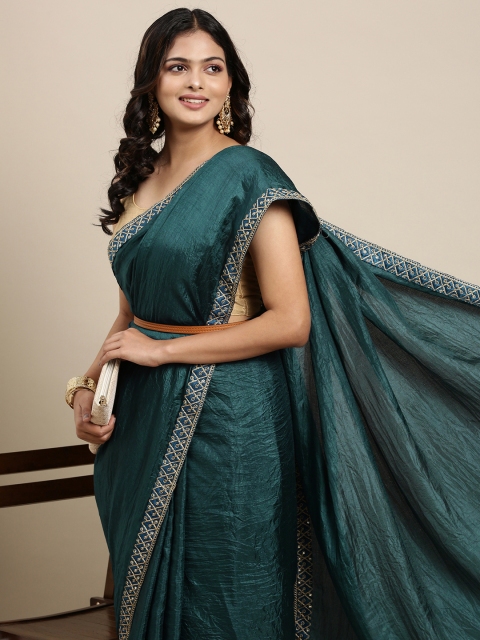 

Mitera Teal Green Solid Saree wtih Embroidered Border